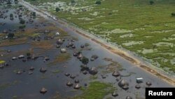 FILE: An aerial view shows flooded homes within a village after the River Nile broke the dykes in Jonglei State, South Sudan. Taken October 5, 2020.