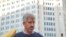 Former Wall Street Journal reporter Jay Solomon poses for photograph in front of a building in Bethesda, Maryland, US, Sept. 28, 2022