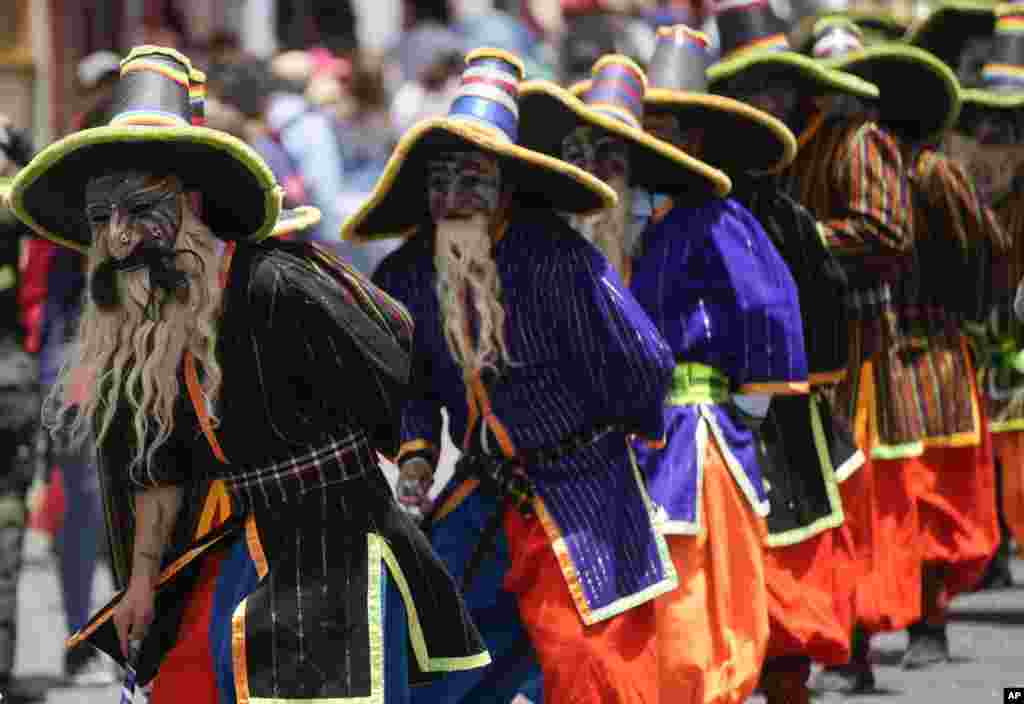 Students perform in the traditional "Auqui Auqui" dance during the University Folk Fair, in La Paz, Bolivia, Oct. 22, 2022.
