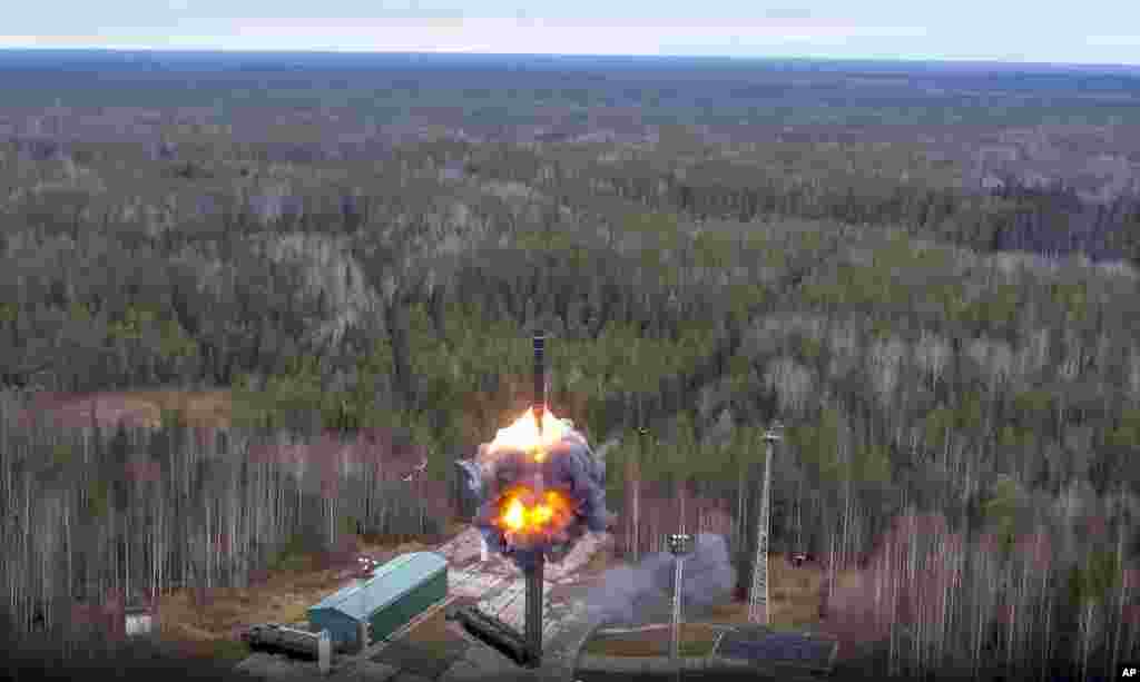 In this handout image taken from video released by Russian Defense Ministry Press Service, a Yars intercontinental ballistic missile is test-fired as part of Russia&#39;s nuclear drills from a launch site in Plesetsk, northwestern Russia.