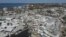 In this photo shot with a drone, shrimp boats lie grounded atop what was a mobile home park, following the passage of Hurricane Ian, on San Carlos Island in Fort Myers Beach, Fla., Oct. 7, 2022. 