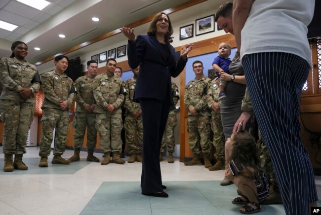 U.S. Vice President Kamala Harris, center, meets soldiers and their families as she visits the demilitarized zone (DMZ) separating the two Koreas, in Panmunjom, South Korea, Sept. 29, 2022.