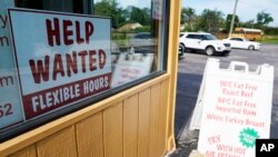 FILE - A help wanted sign is displayed in Deerfield, Illinois, Sept. 21, 2022. 