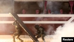 South Korea&#39;s soldiers take part in an anti-terror drill to prepare against chemical and drone attacks, at Korea International Exhibition Center in Goyang.