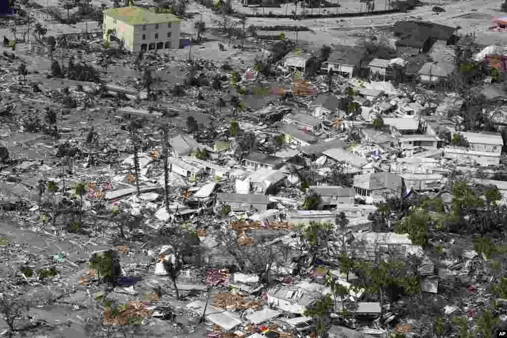 Damaged homes and debris are shown after Hurricane Ian hit in Fort Myers, Florida.