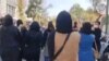 A screengrab from video posted to Twitter on Oct. 8, 2022, by @1500tasvir purports to show Iranian women marching in an anti-government protest.