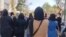 A screengrab from video posted to Twitter on Oct. 8, 2022, by @1500tasvir purports to show Iranian women marching in an anti-government protest.