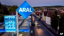 Cars drive by a gas station in Need Anspach near Frankfurt, Germany, Oct. 7, 2022. Anxiety about soaring energy bills has dominated the regional election in Lower Saxony.