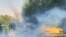 FILE - In this Oct. 1, 2022, photo taken by an individual not employed by the Associated Press and obtained by the AP outside Iran, tear gas is fired by security to disperse protesters in front of the Tehran University, Iran. 