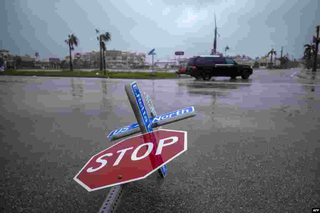 A blown-down street sign is seen as the eye of Hurricane Ian passes by in Punta Gorda, Florida, on Sept. 28, 2022.