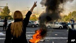 FILE - In this photo taken by an individual not employed by the Associated Press and obtained by the AP outside Iran, Iranians protests the death of 22-year-old Mahsa Amini after she was detained by the morality police, in Tehran, Oct. 1, 2022.