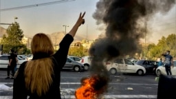FILE - In this photo taken by an individual not employed by the Associated Press and obtained by the AP outside Iran, Iranians protest the death of 22-year-old Mahsa Amini after she was detained by the morality police, in Tehran, Oct. 1, 2022.
