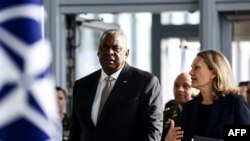 US Defense Secretary Lloyd Austin and U.S. Permanent Representative to NATO Julianne Smith arrive for a two-day meeting of the alliance's Defence Ministers at the NATO Headquarter in Brussels, Oct. 12, 2022.