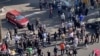 In this frame grab from video taken by an individual not employed by the Associated Press and obtained by the AP outside Iran shows people block an intersection during a protest to mark 40 days since the death of Mahsa Amini, in Tehran, Oct. 26, 2022. 
