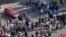 In this frame grab from video taken by an individual not employed by the Associated Press and obtained by the AP outside Iran shows people block an intersection during a protest to mark 40 days since the death of Mahsa Amini, in Tehran, Oct. 26, 2022. 