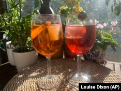 Venetian Spritz is wine-based cocktail. Its modern form consists of prosecco, digestive bitters and soda water. Pictured here is an Aperol Spritz, left, and Select Spritz. (AP Photo/Louise Dixon)