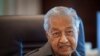 FILE - Malaysia's former Prime Minister Mahathir Mohamad speaks during an interview with The Associated Press at his office in Kuala Lumpur, Malaysia, Friday, Aug. 19, 2022.