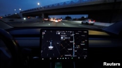 In this file photo, a Tesla Model 3 vehicle drives on autopilot along the 405 highway in Westminster, California, U.S., March 16, 2022. (REUTERS/Mike Blake/File Photo)