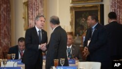 Secretary of State Antony Blinken, left, greets dignitaries from Pacific Island Countries during the U.S.-Pacific Island Country Summit at the State Department in Washington on Sept. 28, 2022.