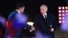 Russian President Vladimir Putin, right, and Denis Pushilin, the Russian-installed leader in Ukraine's Donetsk region, attend a concert marking the declared annexation of four Ukraine territories, in Moscow's Red Square, Sept. 30, 2022. (Sputnik/Maksim Blinov/Pool via Reuters)