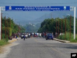 Mexico VenezMigrants, mostly from Venezuela, arrive at a camp where Mexican authorities will arrange permits for their continued travel north, in San Pedro Tapanatepec, Oaxaca, Mexico Wednesday, Oct. 5, 2022. (AP Photo/Marco Ugarte)