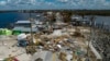 An aerial picture taken on Oct. 1, 2022 shows a broken section of the Pine Island Road, debris and destroyed houses in the aftermath of Hurricane Ian in Matlacha, Florida. 