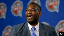 FILE - Former NBA basketball player Dikembe Mutombo laughs during a news conference, February 14, 2015, in New York.
