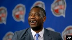 FILE - Former NBA basketball player Dikembe Mutombo laughs during a news conference in New York., Feb. 14, 2015.