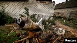 A Russian missile is seen lying in the garden of a house, following an early morning missile strike, as Russia's attacks on Ukraine continue, in Kramatorsk, Donetsk region, Ukraine, Oct. 4, 2022.