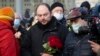 FILE - Vladimir Kara-Murza, Russian opposition activist, center, arrives to lay flowers near the place where opposition leader Boris Nemtsov was gunned down, in Moscow, Feb. 27, 2021. 