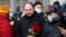 FILE - Vladimir Kara-Murza, Russian opposition activist, center, arrives to lay flowers near the place where opposition leader Boris Nemtsov was gunned down, in Moscow, Feb. 27, 2021. 