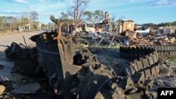 This photograph taken Oct. 7, 2022, shows a destroyed Russian tank in Yats'kivka, on the east bank of the Oskil River, eastern Ukraine.