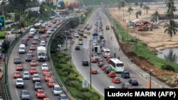 FILE— A picture taken on December 19, 2019 shows cars stuck in traffic in Le Plateau district in Abidjan. 