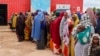 Somali women and children who left rural areas due to drought receive nutritional assistance at a camp for the internally displaced, on the outskirts of Baidoa, Somalia, Oct. 12, 2022.