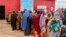 FILE - Somali women and children who left rural areas due to drought receive nutritional assistance at a camp for the internally displaced, on the outskirts of Baidoa, Somalia, Oct. 12, 2022.