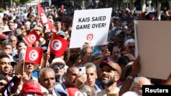 Protesters rally against Tunisian President Kais Saied, in Tunis, Oct. 15, 2022.