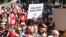 Protesters rally against Tunisian President Kais Saied, in Tunis, Oct. 15, 2022.
