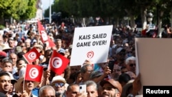 FILE - Protesters rally against Tunisian President Kais Saied, in Tunis, Oct. 15, 2022.