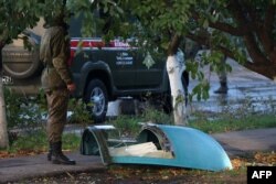 The fragment of a Sukhoi Su-34 military jet is seen at the crash site in the courtyard of a residential area in the town of Yeysk in southwestern Russia, Oct. 18, 2022.