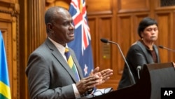 Solomon Islands Foreign Minister Jeremiah Manele, left, and New Zealand Foreign Minister Nanaia Mahuta during their joint media conference at Parliament in Wellington, New Zealand, Oct. 4, 2022. 