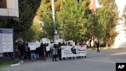 This photo taken by an individual not employed by the AP and obtained outside Iran shows students of the Sharif University of Technology at a protest sparked by the death in September of 22-year-old Mahsa Amini in the custody of police, in Tehran, Oct. 7,