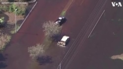 Troops Push Humvee Through Hurricane-Flooded Road 