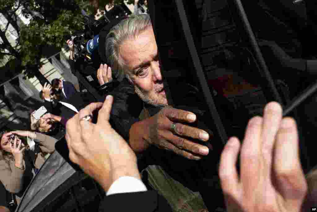 Steve Bannon, center, a longtime ally of former President Donald Trump and convicted of contempt of Congress, leaves the federal courthouse in Washington. Bannon was sentenced to 4 months behind bars for defying January 6 committee subpoena.