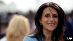 FILE: French Secretary of State for Development, Francophonie and International Partnerships Chrysoula Zacharopoulou arrives to attend the Bastille Day military parade on the Champs-Elysees avenue in Paris on July 14, 2022. 