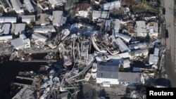 An aerial view of damaged boats and property after Hurricane Ian caused widespread destruction in Fort Myers, Florida, Sept. 30, 2022.