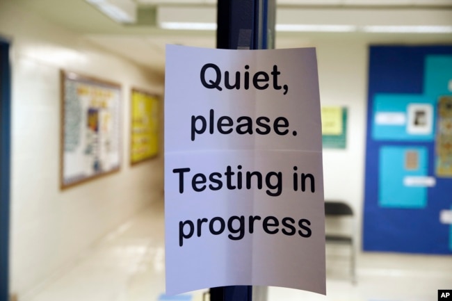 FILE - In this Jan. 17, 2016 file photo, a sign is seen at the entrance to a hall for a college test preparation class in Bethesda, Md.