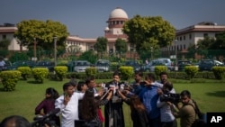 Aftab Ali Khan, a lawyer representing one of the petitioners briefs media representatives on Supreme Court premises in New Delhi, India, Oct. 13, 2022. 