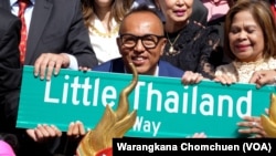 Juttana Rimreartwate (Moo), a Leader of the Thai Community in New York holds a “Little Thailand Way" street sign during the street co-naming ceremony in Elmhurst, a neighborhood of the borough of Queens, New York. (Sept 24, 2022.)
