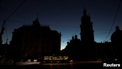 The city center of Lviv, Ukraine, is shrouded in darkness as it has no electricity after critical civil infrastructure was hit by Russian missile attacks on Oct. 10, 2022. 