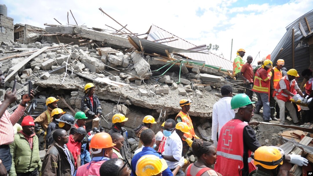 Rescuers search through a multi-storey collapsed apartment building in Kirigiti, Kiambu County, Kenya, Sept. 26, 2022. 